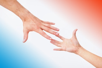Two hands reach out for each other