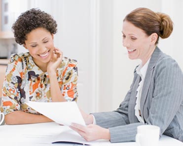 a patient advocate helps her client go through medical paperwork