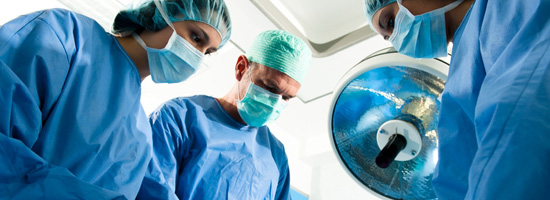 A group of surgeons operate on a patient